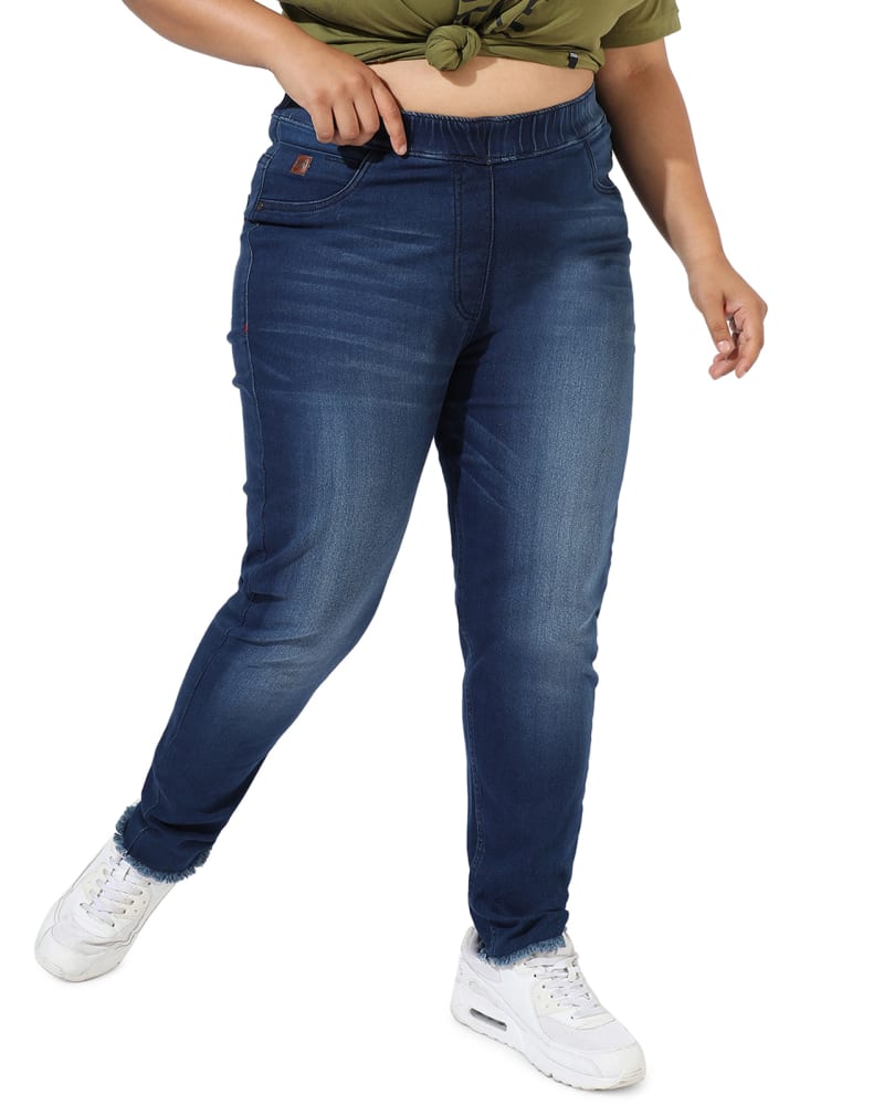 Front of a model wearing a size 38 Blue Skinny Jeans in Navy by Instafab Plus. | dia_product_style_image_id:297303